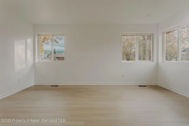 an empty room with windows