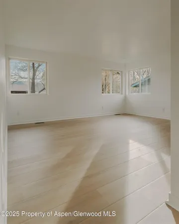 a view of an empty room with a window