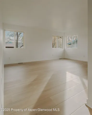 a view of an empty room with a window