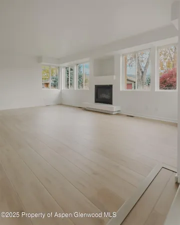 a view of an empty room with a window