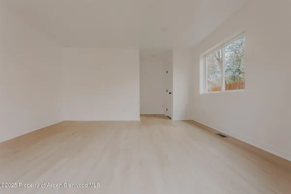 an empty room with windows