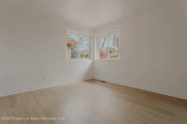 an empty room with windows