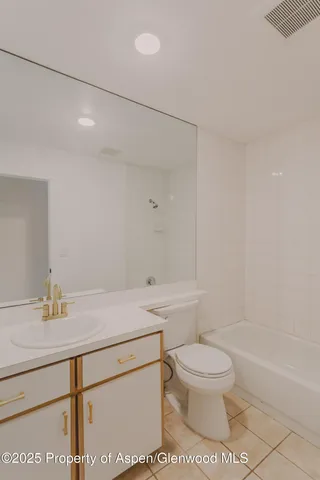 a bathroom with a sink a toilet and a bathtub