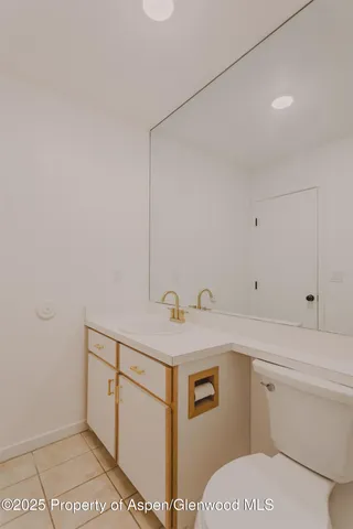 a bathroom with a sink and toilet