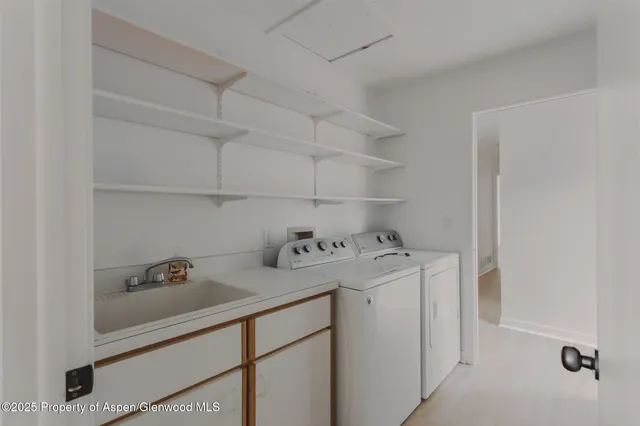 a utility room with dryer and washer