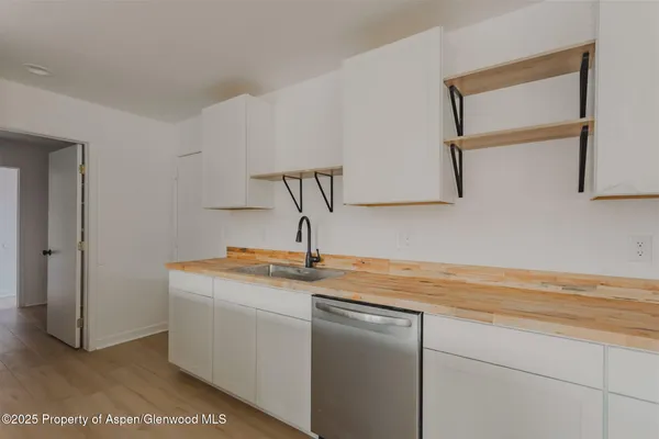 a kitchen with a sink and cabinets