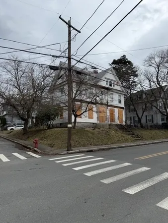 a view of a house with a street