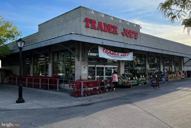 a view of a cafe with sitting area