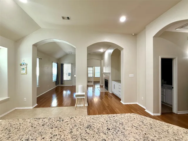 a view of a living room and bedroom
