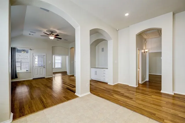 wooden floor in an empty room with a mirror