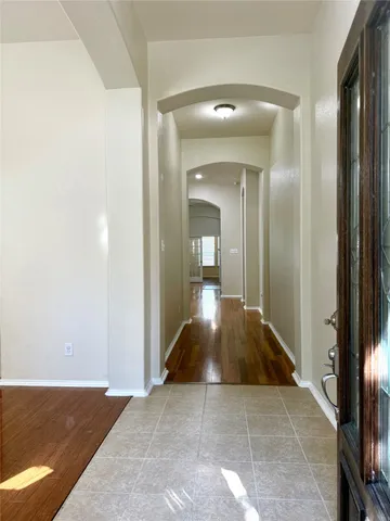 hallway view with wooden floor and living room