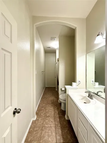 a bathroom with a double vanity sink and mirror