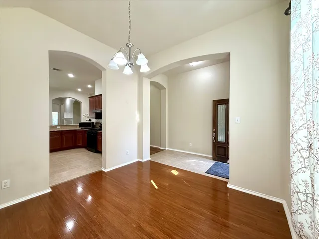 a view of a kitchen with a sink and a window