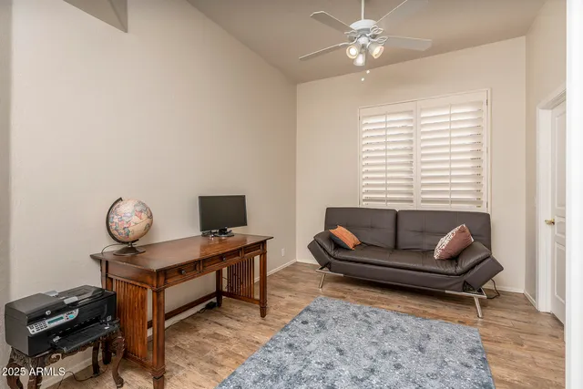 a living room with furniture and a window