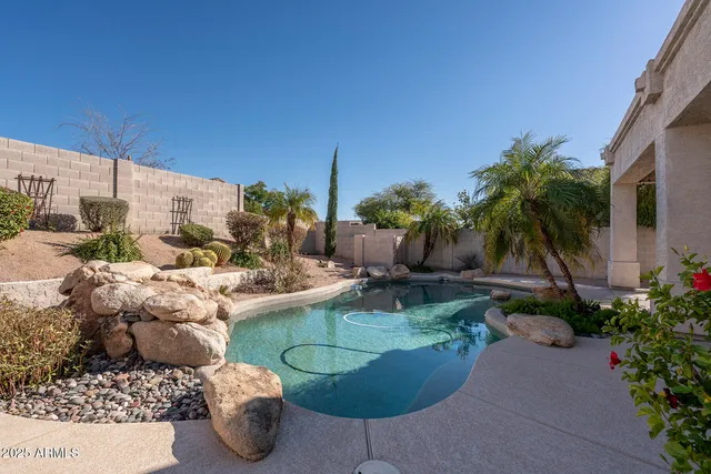 a view of a patio with couches and potted plants