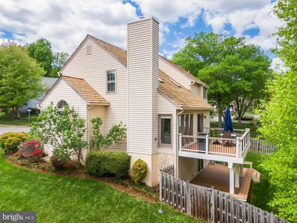 a view of house with backyard and garden