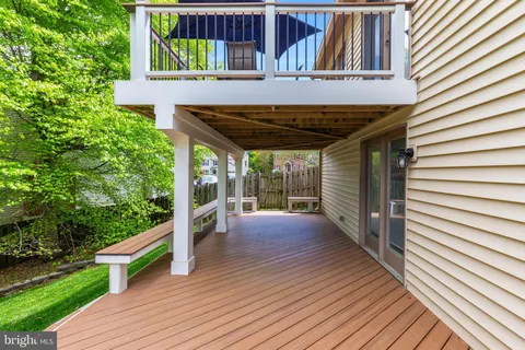 a bathroom with a shower a mirror and a sink