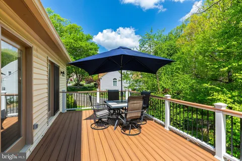 a living room with furniture a fireplace and a floor to ceiling window