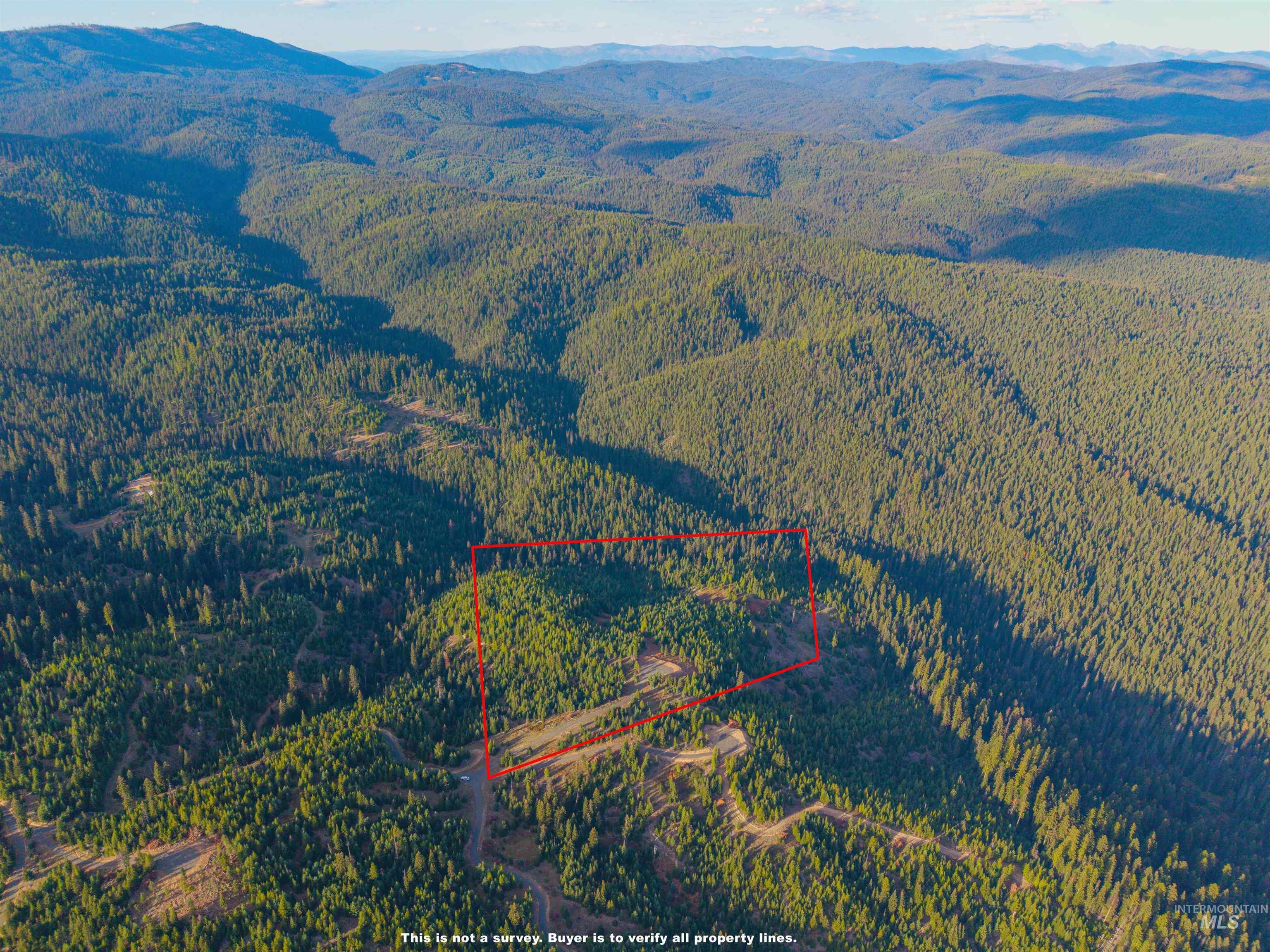 9 Tree Farm Trails Road Elk City, ID 83525 - Photo 12 of 14 Aerial view of property's location with property boundaries highlighted and a mountain backdrop