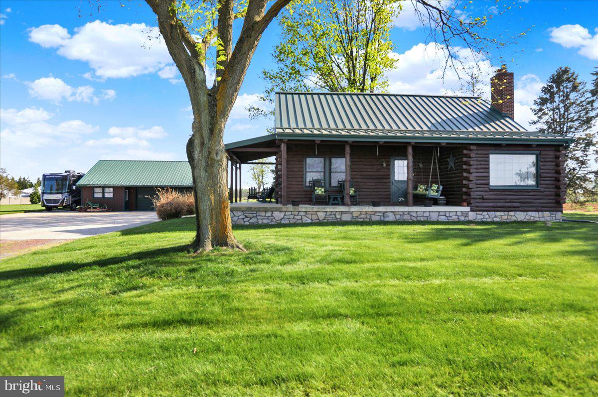 274 South Erisman Road Manheim, PA 17545 - Photo 1 of 43 a front view of a house with garden
