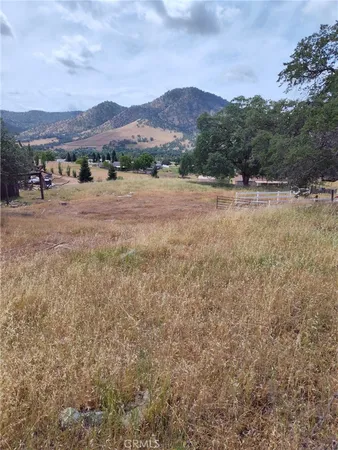 a view of a town with mountains in the background