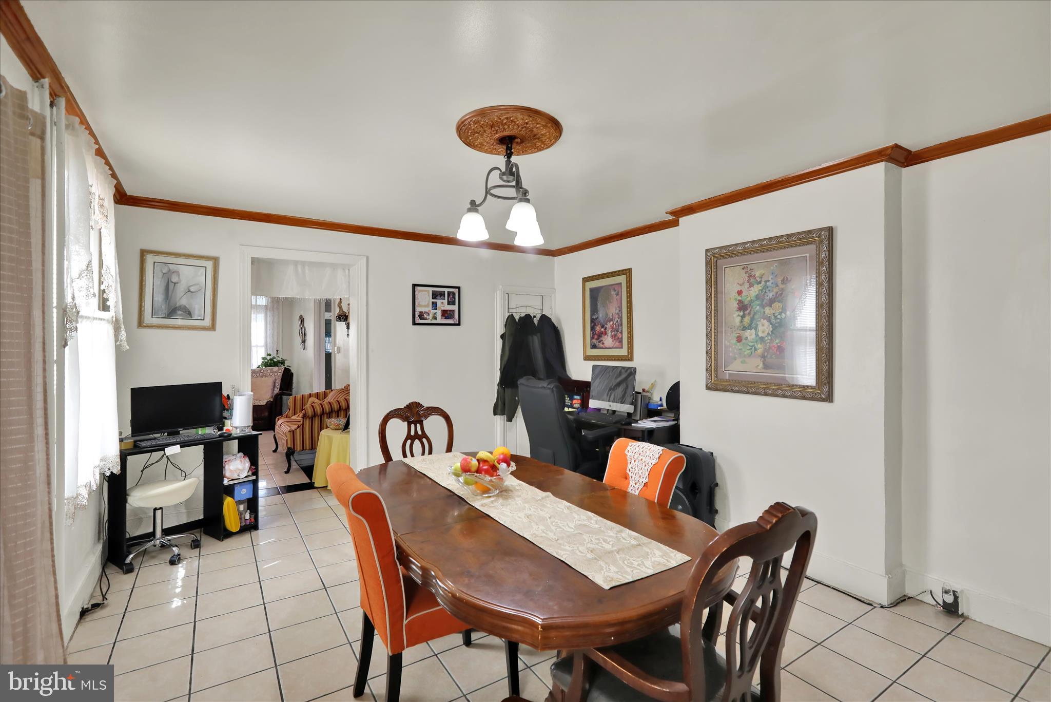 407 South 7th Street Reading, PA 19602 - Photo 11 of 36 a view of a dining room with furniture and a chandelier