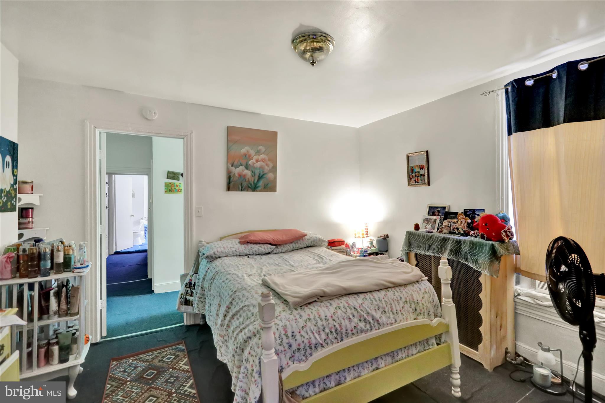 407 South 7th Street Reading, PA 19602 - Photo 23 of 36 a bedroom with a bed and a desk