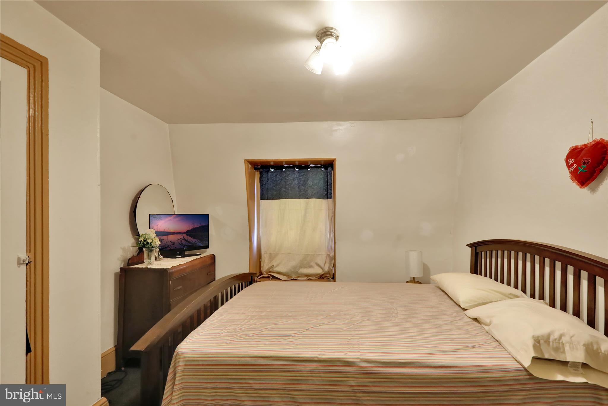 407 South 7th Street Reading, PA 19602 - Photo 34 of 36 a bedroom with a bed and a tv in it