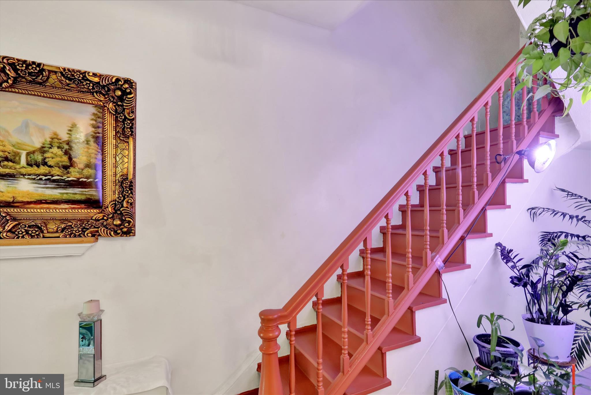 407 South 7th Street Reading, PA 19602 - Photo 6 of 36 a view of staircase with wooden floor and a potted plant