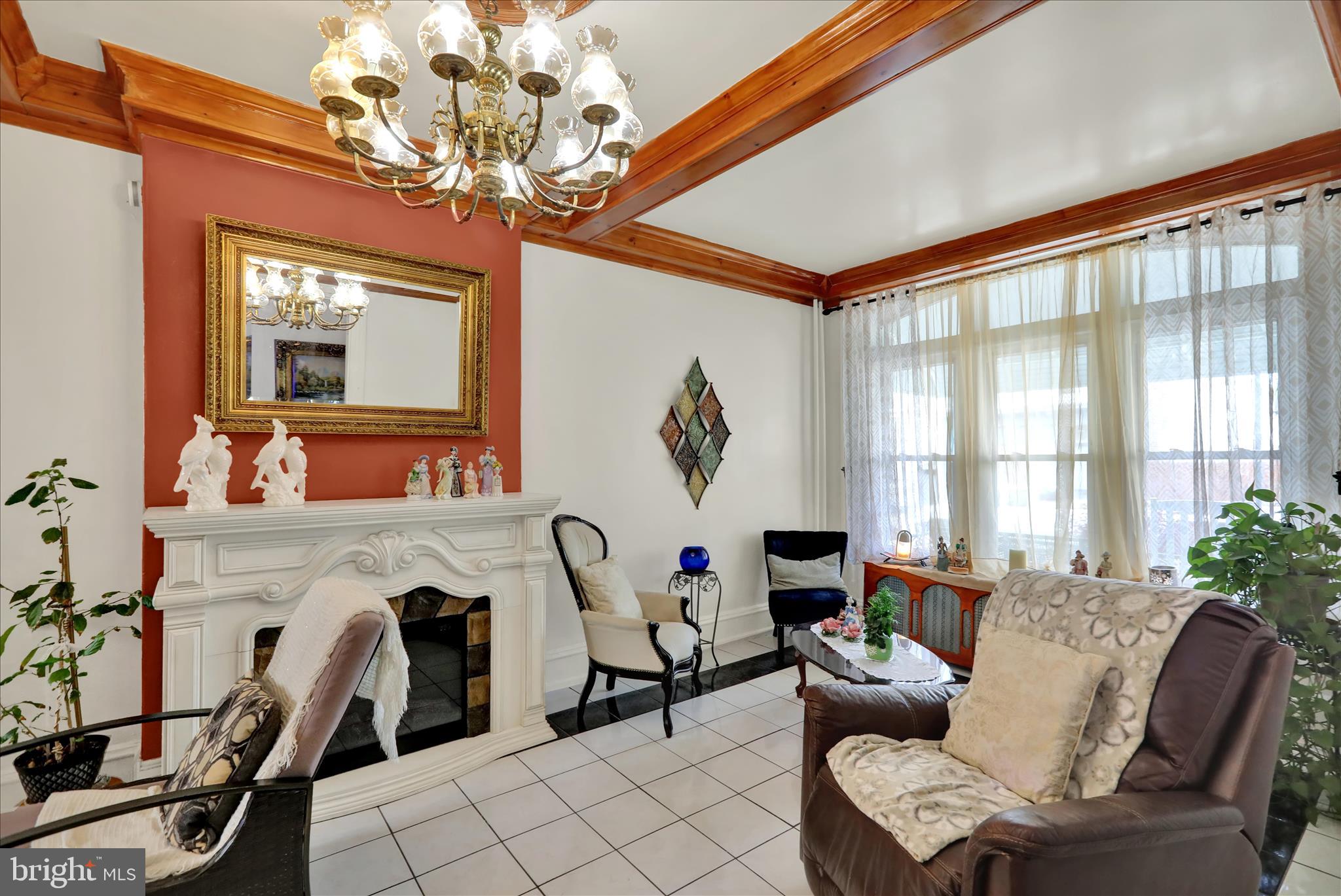 407 South 7th Street Reading, PA 19602 - Photo 7 of 36 a living room with patio furniture and a chandelier