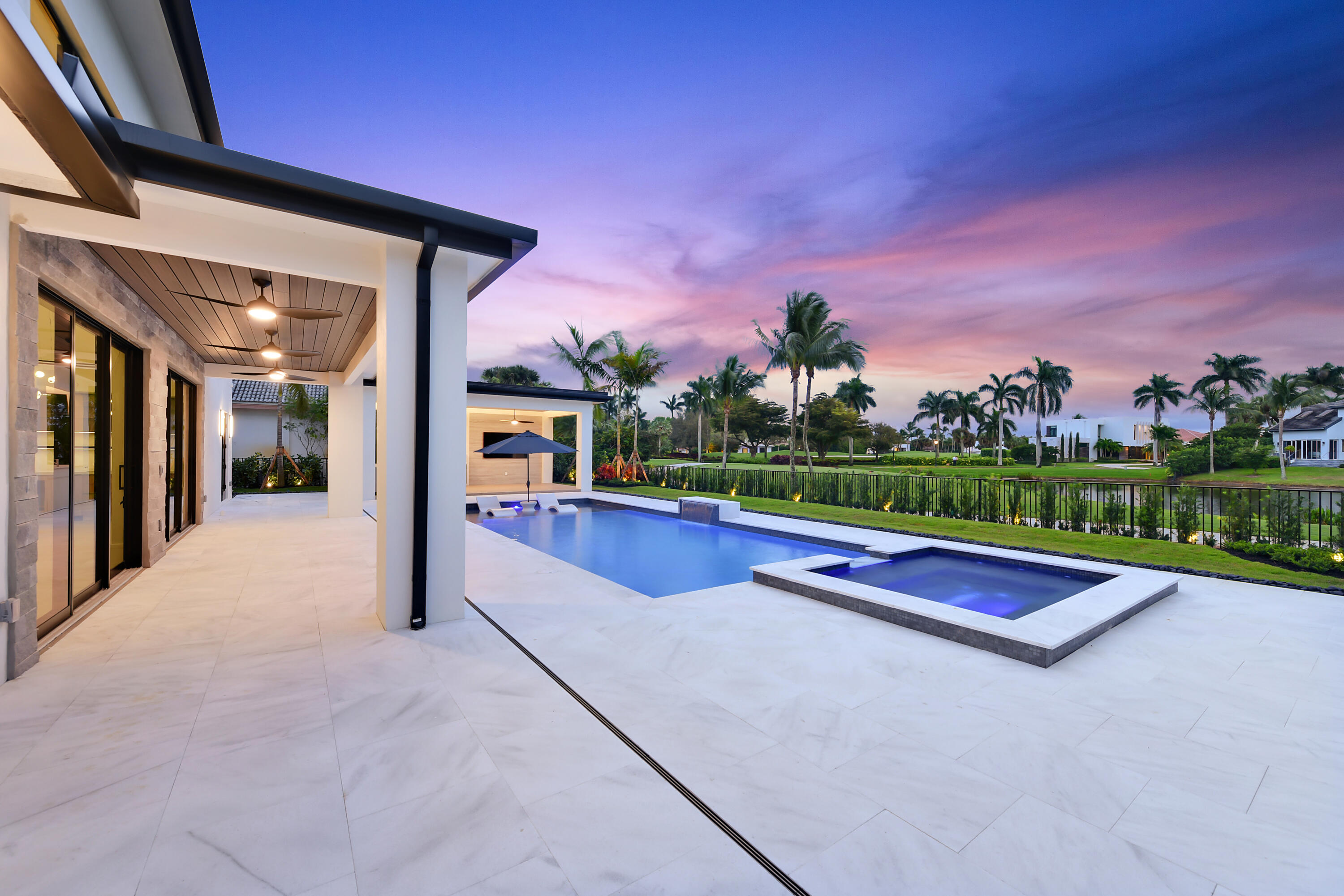 17577 Scarsdale Way Boca Raton, FL 33496 - Photo 11 of 145 a view of swimming pool with a yard and a car park in front of house