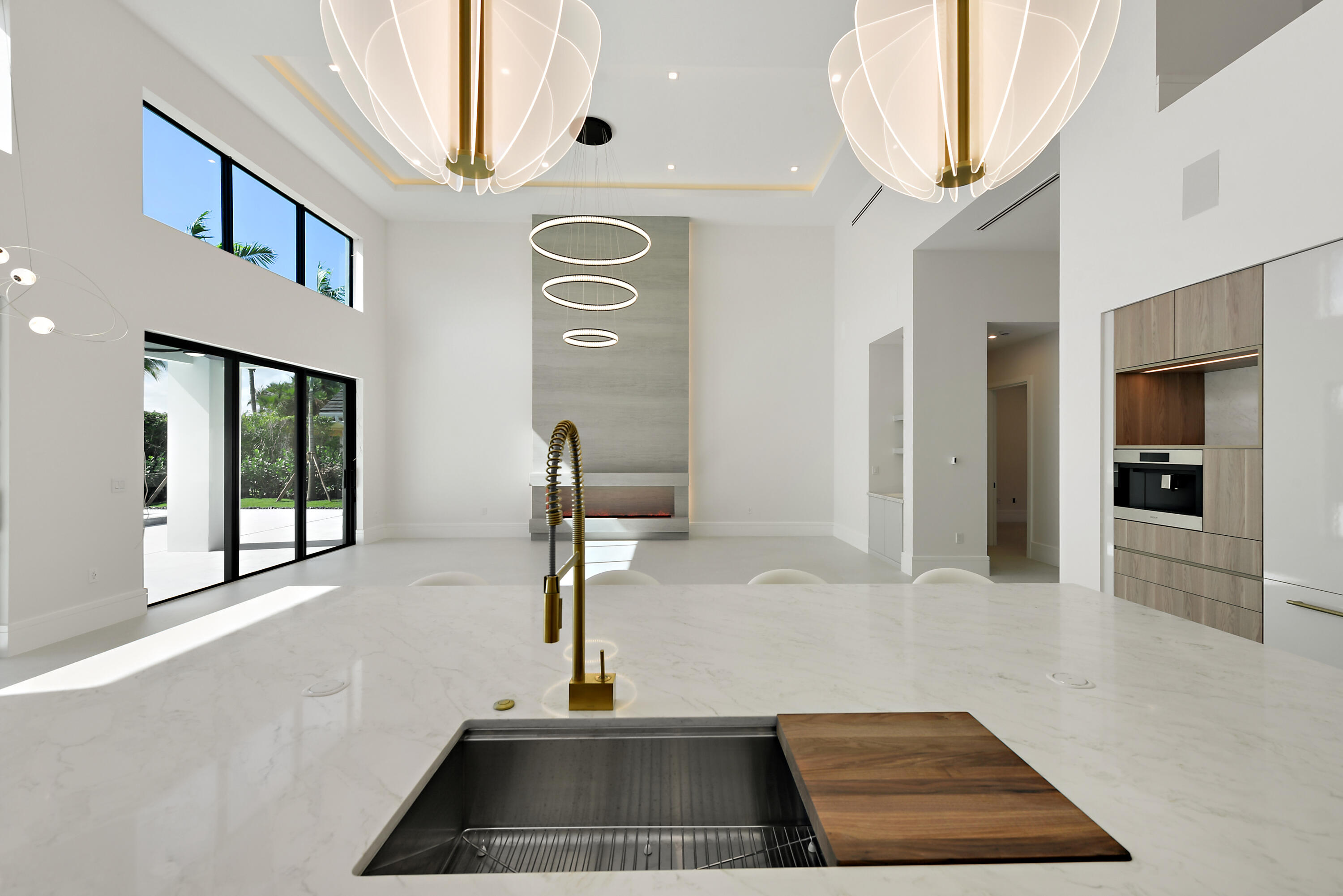 17577 Scarsdale Way Boca Raton, FL 33496 - Photo 29 of 145 a view of a hallway with windows and chandelier