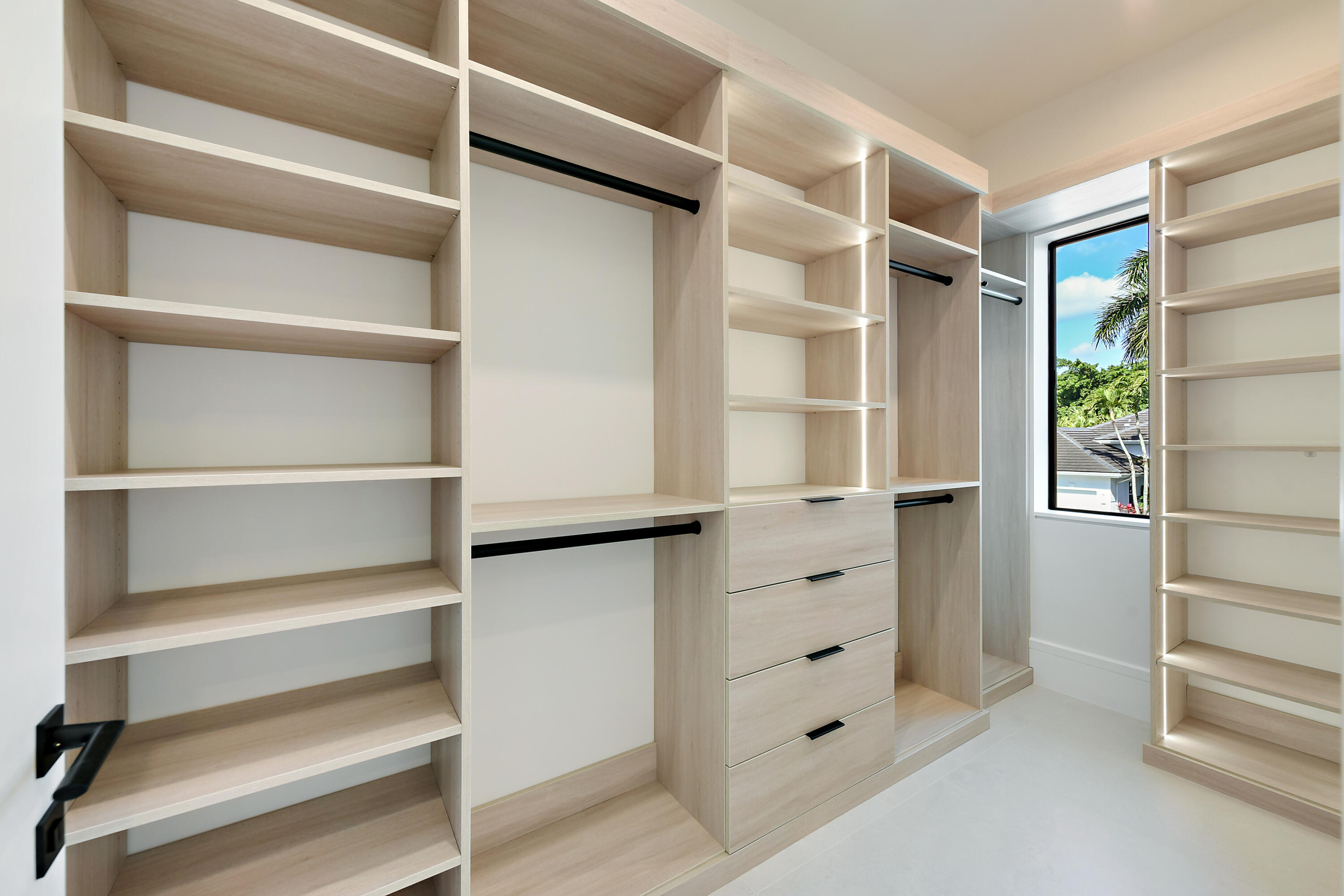 17577 Scarsdale Way Boca Raton, FL 33496 - Photo 62 of 145 a view of walk in closet with empty racks