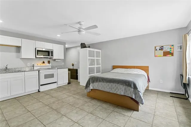 a kitchen with stainless steel appliances a refrigerator sink and cabinets
