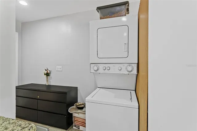 a front view of house with deck and yard