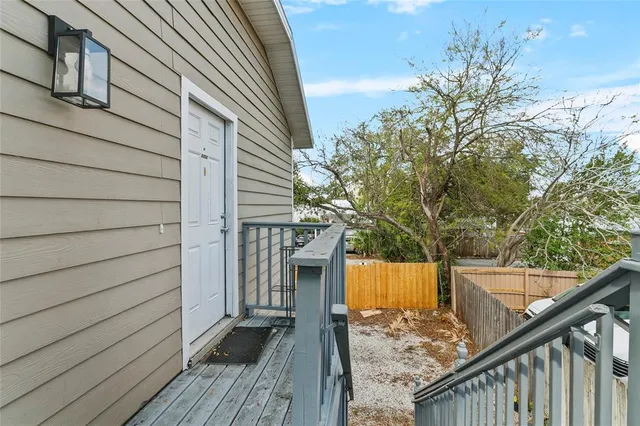 a kitchen with a sink and a wooden floor