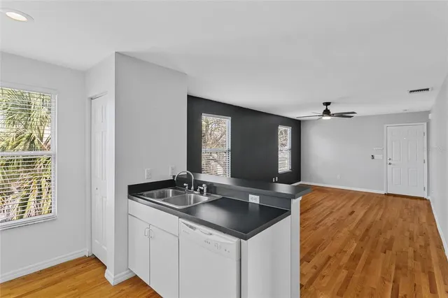 a kitchen with stainless steel appliances a refrigerator stove and microwave