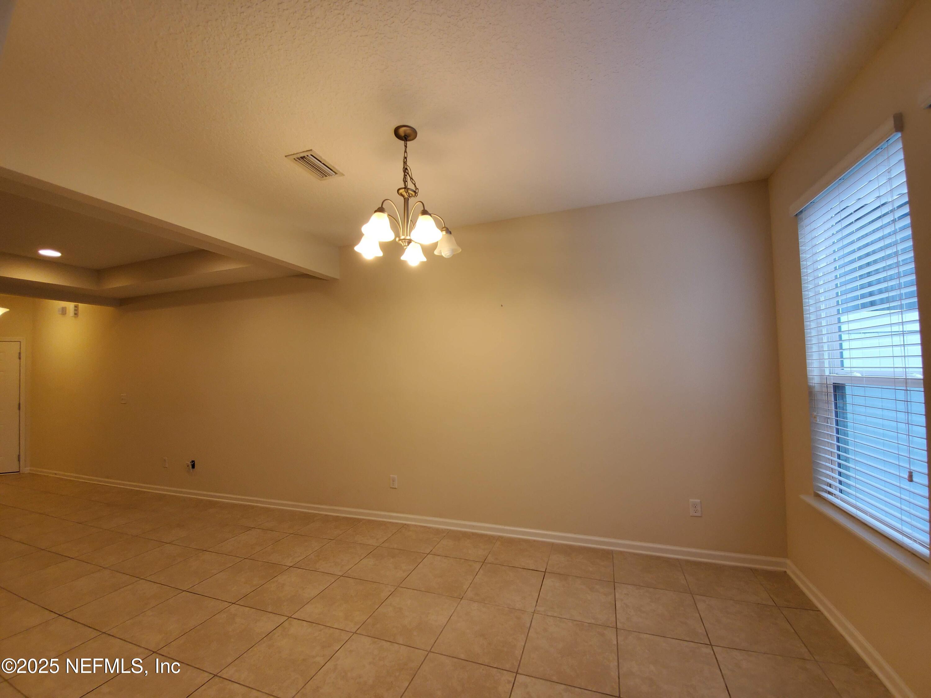 13 La Paz Way St. Augustine, FL 32092 - Photo 18 of 24 a view of a livingroom with a chandelier