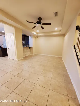 a view of a livingroom with a furniture and a ceiling fan