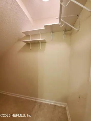 a view of small space with racks on the wall