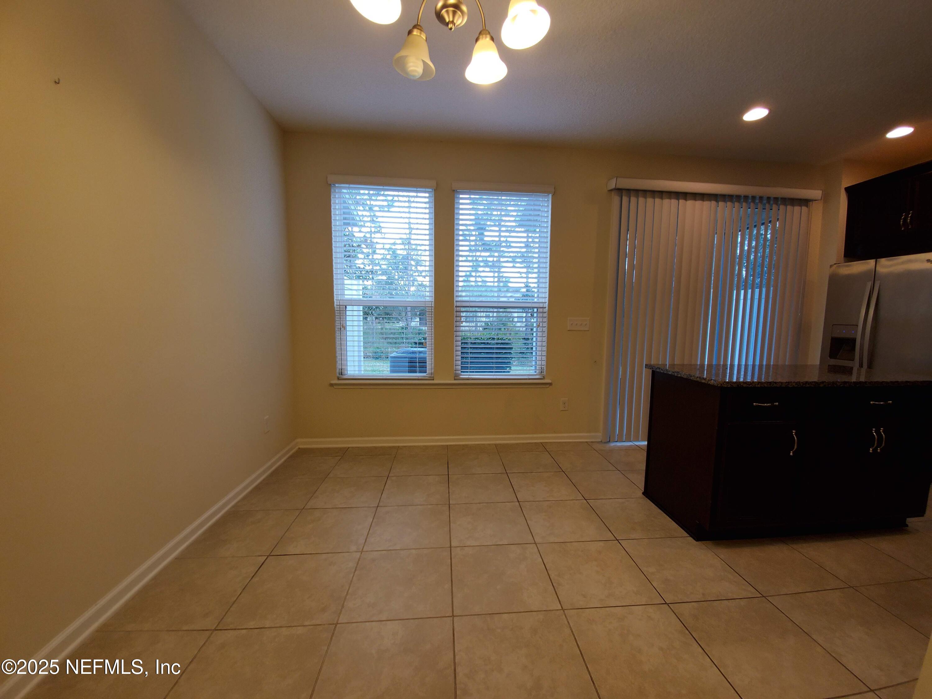 13 La Paz Way St. Augustine, FL 32092 - Photo 5 of 24 a view of an empty room with a window