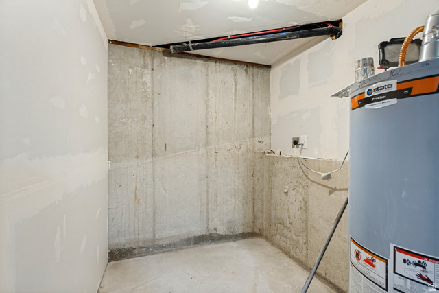 62 South Clark Lane Elk Ridge, UT 84651 - Photo 26 of 30 Laundry/Utility area featuring a water heater and electrical outlet