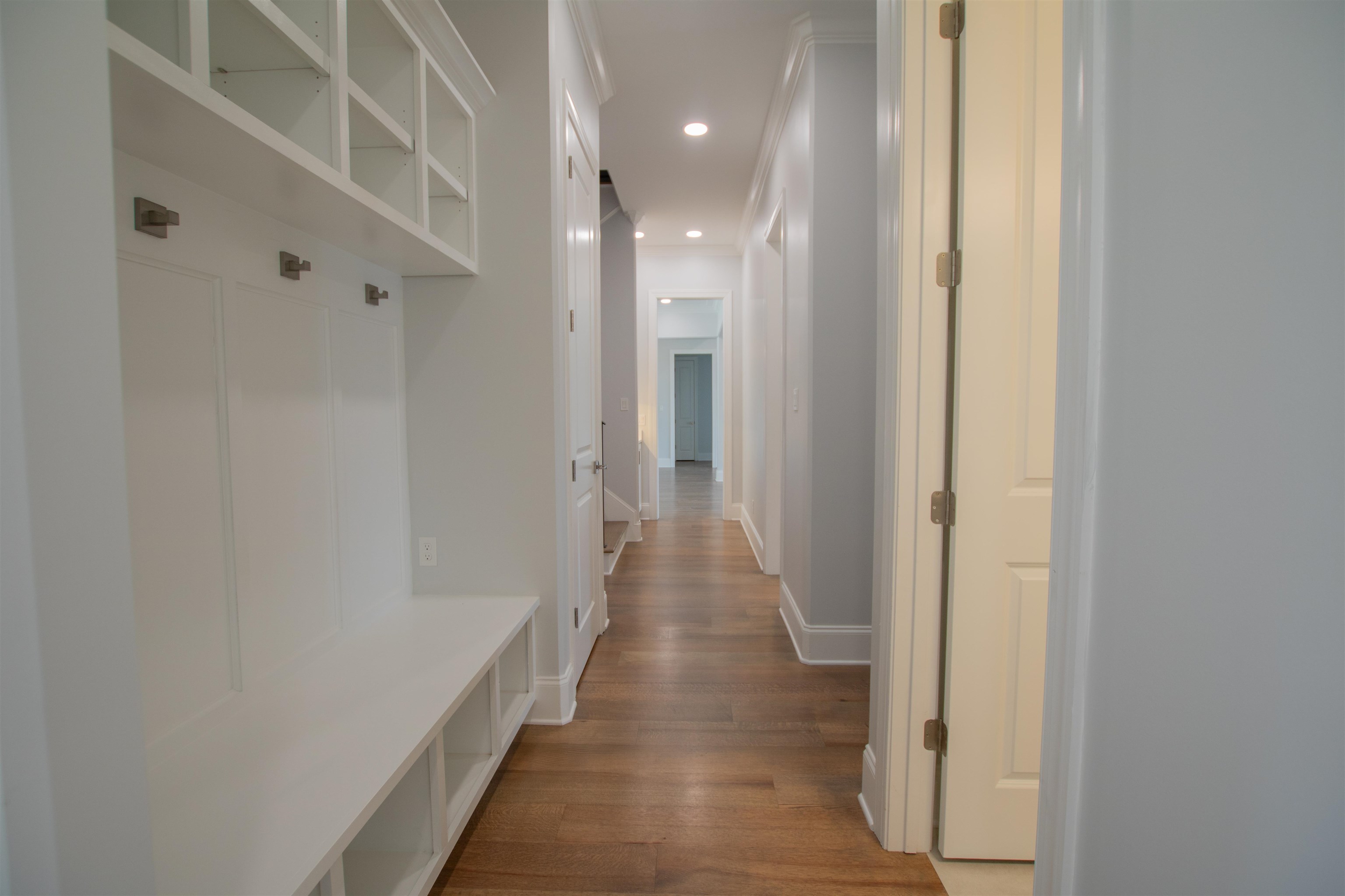 2611 Moore Road Germantown, TN 38138 - Photo 16 of 35 Mudroom with crown molding and hardwood / wood-style floors