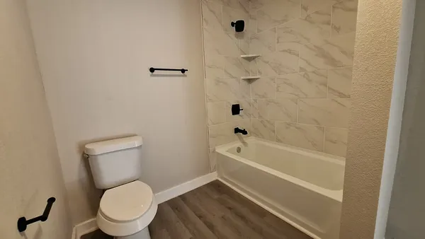 a balcony with wooden floor