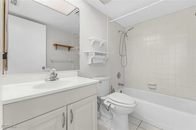 a view of an empty room with a painting on the wall