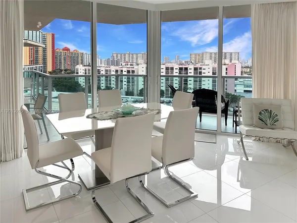 a view of a dining room with furniture window and outside view
