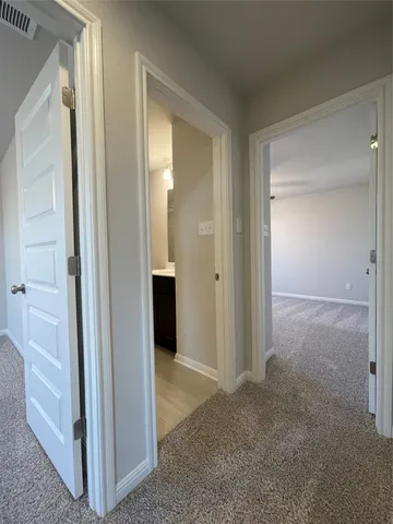a view of empty room with window and fireplace