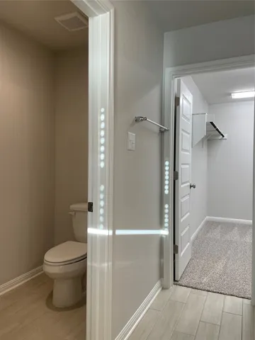 a bathroom with a glass shower door
