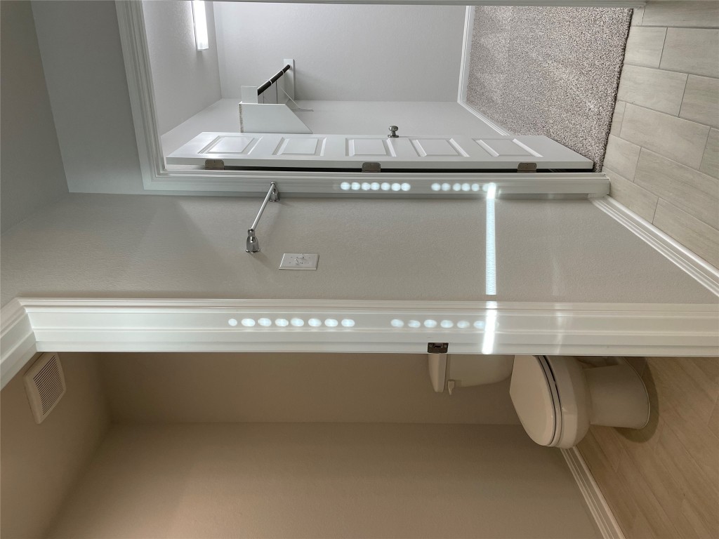 125 Old Stagecoach Road Jarrell, TX 76537 - Photo 23 of 31 a bathroom with a granite countertop toilet and a shower