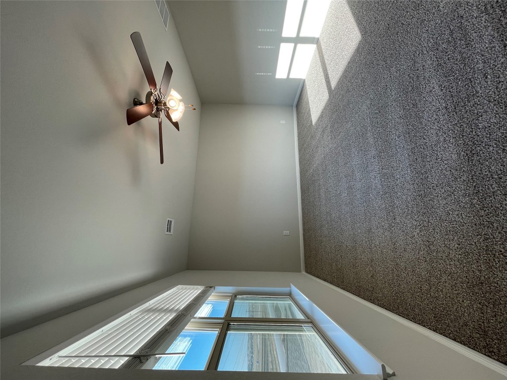 125 Old Stagecoach Road Jarrell, TX 76537 - Photo 25 of 31 a view of a livingroom with a ceiling fan and window